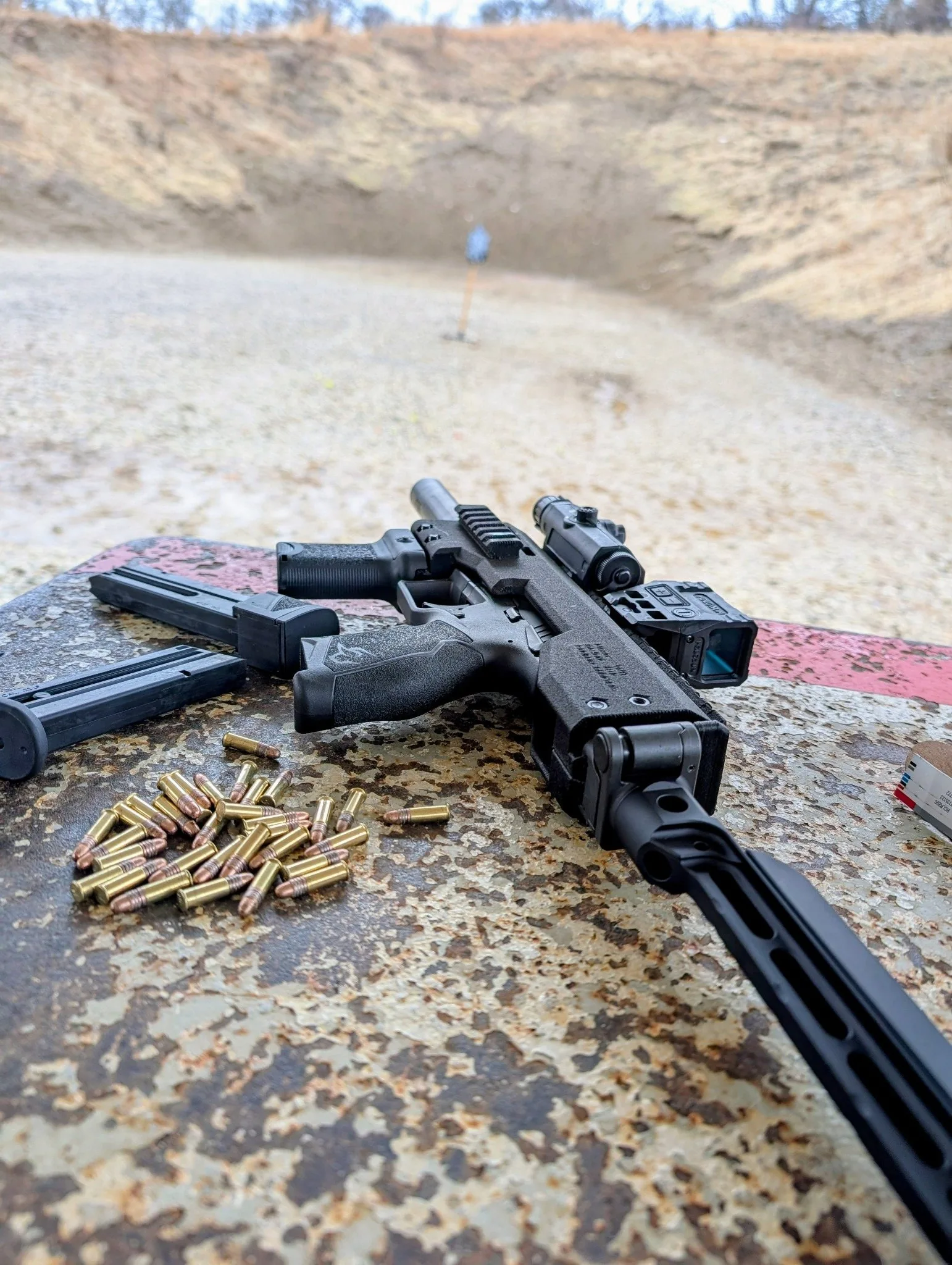 Pistol-caliber carbine positioned for range testing